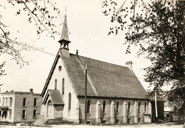 Formerly on the corner of Court and South Bluff Streets, the All Souls Church was later converted into a "flat building".