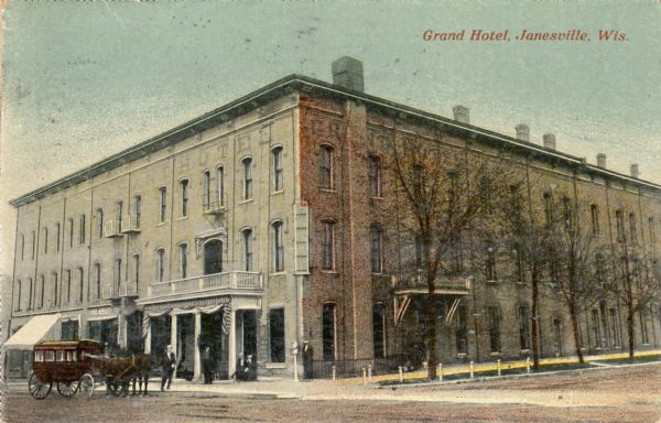 View across street towards the Grand Hotel, with a stagecoach in front. Caption reads: "Grand Hotel, Janesville, Wis."
