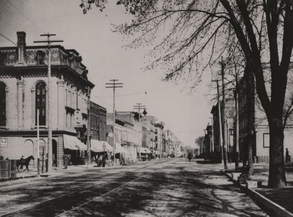 Looking northwest from the Methodist Episcopal Church, Main Street, with trolley track running down the center of the street.