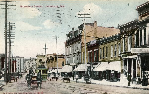 Milwaukee Street with trolley and horse-drawn vehicles. Caption reads: "Milwaukee Street, Janesville, Wis."