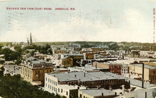 Elevated view of Janesville. Caption reads: "Bird's-eye View from Court House, Janesville, Wis."