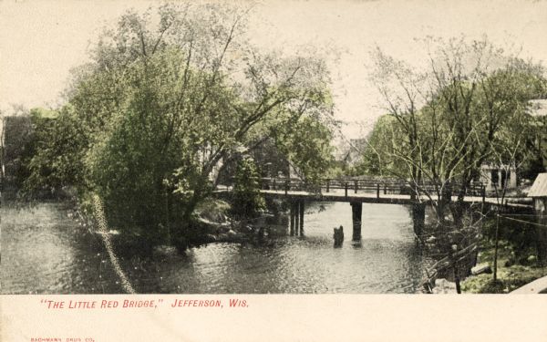 Elevated view of a bridge in Jefferson. Caption reads: "'The Little Red Bridge,' Jefferson, Wis."