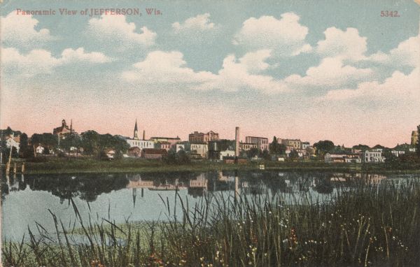 View of Jefferson across the Rock River. Caption reads: "Panoramic View of Jefferson, Wis."