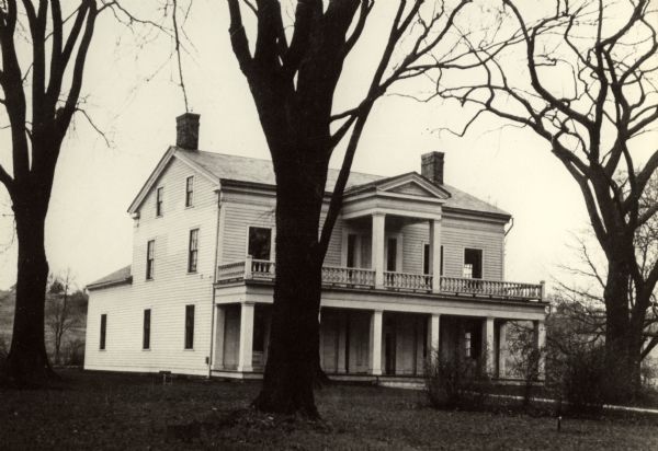 The Grignon house was built (at the later address of 1313 Augustine Street) in 1836 by Charles Grignon. Charles Grignon was the son of Augustin Grignon, one of Wisconsin's first permanent white settlers. Charles paid for the construction of the house in part with the money he recieved for negotiating a treaty with the Menominee Indians. 
Both workmen and materials for the house were brought in from Buffalo, N.Y., then up the Fox River by canoe to the location. The frame structure was built in the Greek Revival style, with fine wood interior, newell post and cherry stair rail, five fireplaces and originally eleven bedrooms. 
The house was originally called "The Mansion in the Woods" and is located in the setting of 100 year-old elms. It was occupied until 1933 and the house served variously as an inn, church, trading post and, later, a museum. The Grignon house was restored in 1940-1941. It then was represented on the Historic American Buildings Survey and the National  Register of Historic Places.