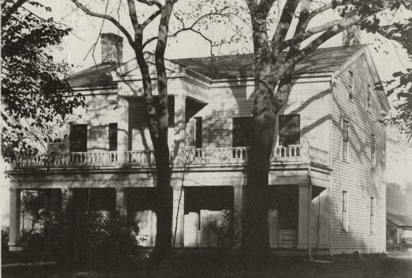 The Grignon house was built (at the later address of 1313 Augustine Street) in 1836 by Charles Grignon. Charles Grignon was the son of Augustin Grignon, one of Wisconsin's first permanent white settlers. Charles paid for the construction of the house in part with the money he recieved for negotiating a treaty with the Menominee Indians. 
Both workmen and materials for the house were brought in from Buffalo, N.Y., then up the Fox River by canoe to the location. The frame structure was built in the Greek Revival style, with fine wood interior, newell post and cherry stair rail, five fireplaces and originally eleven bedrooms. 
The house was originally called "The Mansion in the Woods" and is located in the setting of 100 year-old elms. It was occupied until 1933 and the house served variously as an inn, church, trading post and, later, a museum. The Grignon house was restored in 1940-1941. It then was represented on the Historic American Buildings Survey and the National  Register of Historic Places.