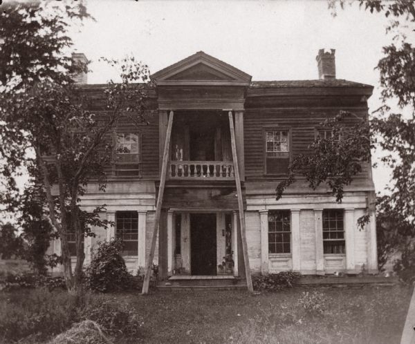 The Grignon house was built (at the later address of 1313 Augustine Street) in 1836 by Charles Grignon. Charles Grignon was the son of Augustin Grignon, one of Wisconsin's first permanent white settlers. Charles paid for the construction of the house in part with the money he recieved for negotiating a treaty with the Menominee Indians. 
Both workmen and materials for the house were brought in from Buffalo, N.Y., then up the Fox River by canoe to the location. The frame structure was built in the Greek Revival style, with fine wood interior, newell post and cherry stair rail, five fireplaces and originally eleven bedrooms. 
The house was originally called "The Mansion in the Woods" and is located in the setting of 100 year-old elms. It was occupied until 1933 and the house served variously as an inn, church, trading post and, later, a museum. The Grignon house was restored in 1940-1941. It then was represented on the Historic American Buildings Survey and the National Register of Historic Places.