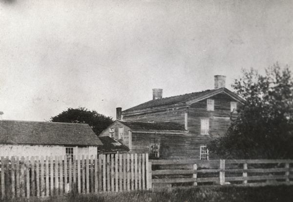 The Grignon house was built (at the later address of 1313 Augustine Street) in 1836 by Charles Grignon. Charles Grignon was the son of Augustin Grignon, one of Wisconsin's first permanent white settlers. Charles paid for the construction of the house in part with the money he recieved for negotiating a treaty with the Menominee Indians. Both workmen and materials for the house were brought in from Buffalo, N.Y., then up the Fox River by canoe to the location. The frame structure was built in the Greek Revival style, with fine wood interior, newell post and cherry stair rail, five fireplaces and originally eleven bedrooms. The house was originally called "The Mansion in the Woods" and is located in the setting of 100 year-old elms. It was occupied until 1933 and the house served variously as an inn, church, trading post and, later, a museum. The Grignon house was restored in 1940-1941. It then was represented on the Historic American Buildings Survey and the National Register of Historic Places.