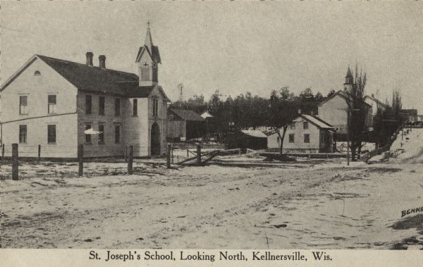 Looking north towards St. Joseph's School and surrounding buildings. Caption reads: "St. Joseph's School, Looking North, Kellnersville, Wis."