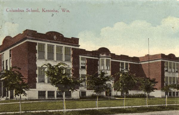 View across street toward the school building. Caption reads: "Columbus School, Kenosha, Wis."