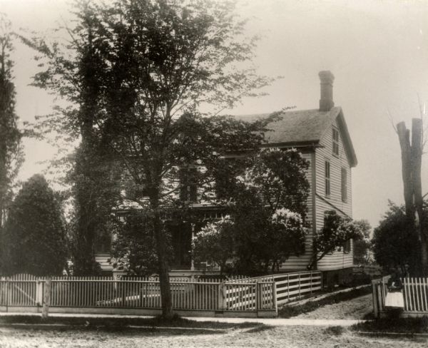The home of Rev. D.H. Deming. The house was built in 1858 on Kenosha Street near Deming Street.
