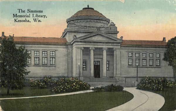 View up curving sidewalk towards the entrance of the library. Caption reads: "Simmons Memorial Library, Kenosha, Wis."