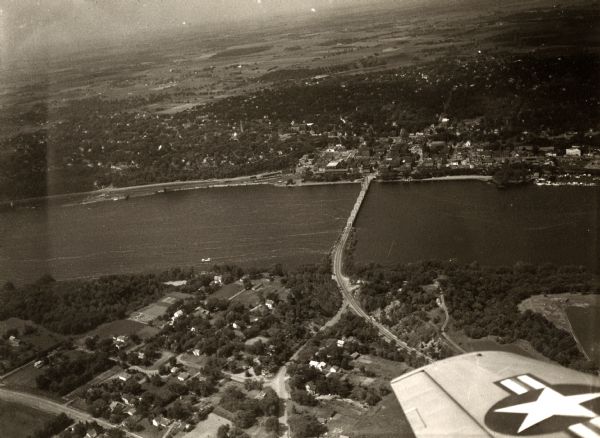 Aerial view of river and town from a military airplane.