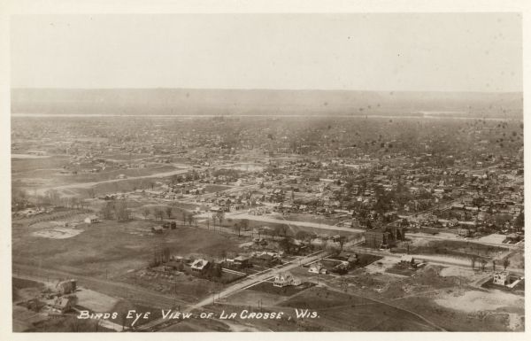 Aerial view of La Crosse, with the Mississippi River in the distance.
