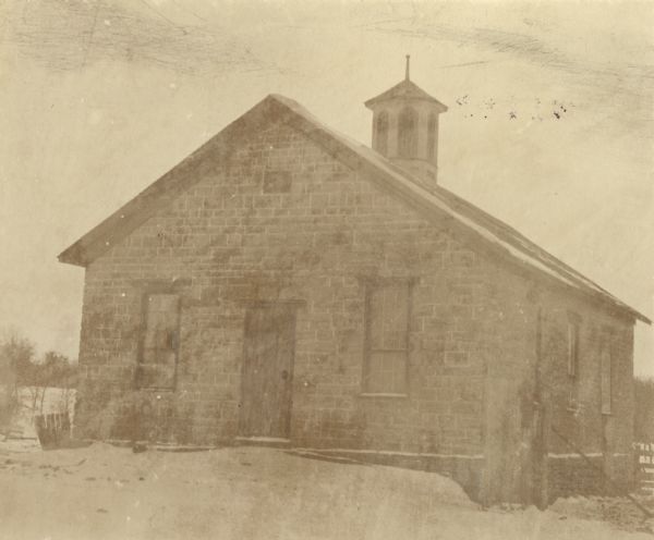 A church in Lamont, locally called the Old Stone Church. At the time of the photo it was being used as a barn.