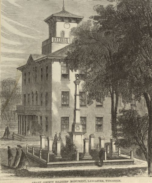 Elevated view of the Grant County Soldier's Monument. A group of people are standing around the monument. A large building is in the background. Caption at bottom reads: "Grant County Soldiers' Monument, Lancaster, Wisconsin."