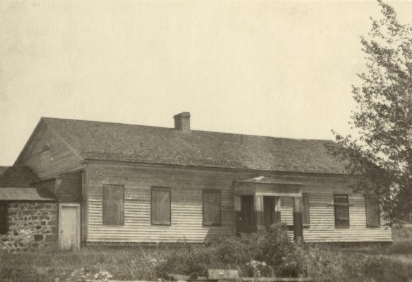 The American Fur Company warehouse, also called Old Treaty Hall. In 1832 the fur company moved its Bayfield post to the Island (Madeline Island), and on the council ground adjoining the building the Chippewa signed the Treaty of 1854 that established their reservations. At some point in its history the building came into the hands of George Francis Thomas, who in turn presented it to the DAR, but it was destroyed by fires shortly thereafter.