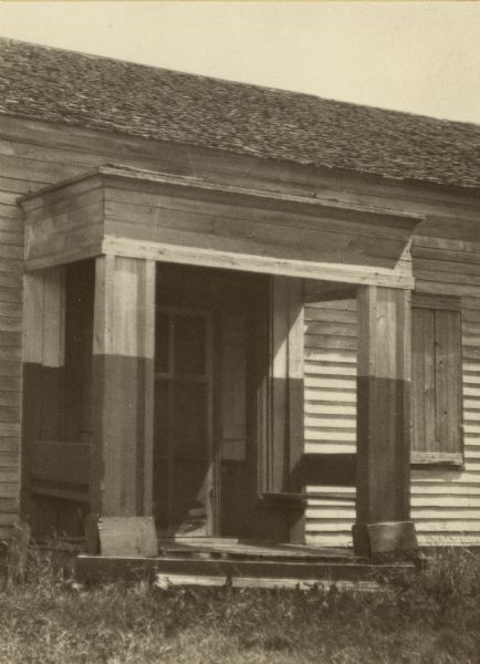 Detail of the entrance of the American Fur Company warehouse, also called Old Treaty Hall. In 1832 the fur company moved its Bayfield post to the Island (Madeline Island), and on the council ground adjoining the building the Chippewa signed the Treaty of 1854 that established their reservations. At some point in its history the bulding came into the hands of George Francis Thomas, who in turn presented it to the DAR, but it was destroyed by fires shortly thereafter.