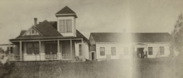 Old Treaty Hall, so called because of a treaty signed there on September 30, 1854 between the Chippewas and the settlers that gave the land to the United States. In later years the building was owned by George Francis Thomas who lived with his family in the cottage during the summer months. He presented the building to the DAR, but it was destroyed by fire shortly thereafter.