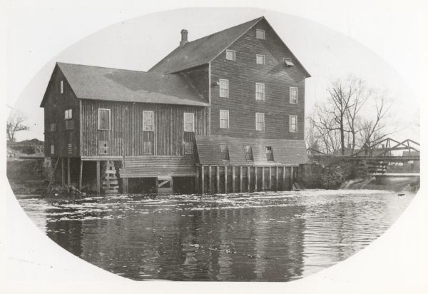 Lemonweir River flour mill built in 1852 and torn down in 1943. Mill and site were purchased in 1926 by the Wisconsin Power and Light Company for a power plant. The mill was re-purchased by Charles K. Davis, the former owner, and operated until it was torn down as noted above.