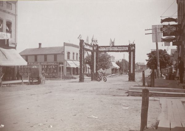 Main Street in Little Chute looking towards Kaukauna; the arch is at the intersection of the street that leads to the Chicago & Northwestern Depot.