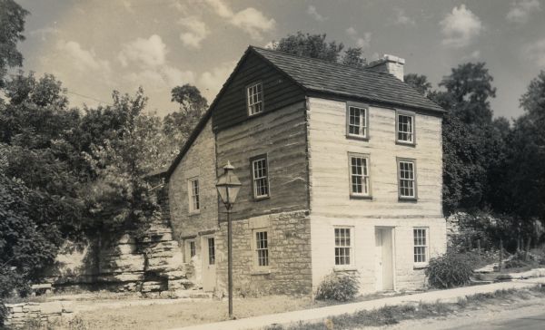A restored Cornish miner's house, called Polperro, on Shake Rag Street. The house was temporarily covered with siding, but after restoration the siding was removed to reveal the original log construction. The building is currently owned by the Wisconsin Historical Society and is one of several structures that comprise the Pendarvis historic site.

