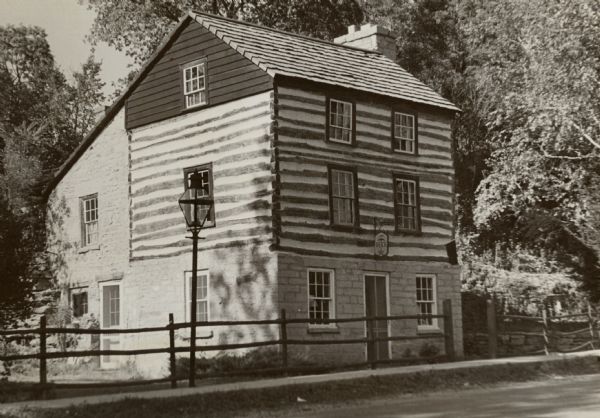 A restored Cornish miner's house, called Polperro, on Shake Rag Street. The house was temporarily covered with siding, but after restoration the siding was removed to reveal the original log construction. The building is currently owned by the Wisconsin Historical Society and is one of several structures that comprise the Pendarvis historic site.
