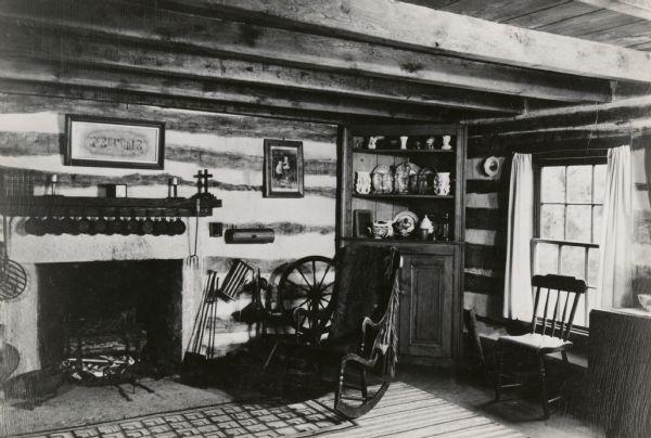 The second floor living room in a restored Cornish miner's house, called Polperro, on Shake Rag Street. The house was temporarily covered with siding, but after restoration the siding was removed to reveal the original log construction. The home is now owned by Robert M. Neal.