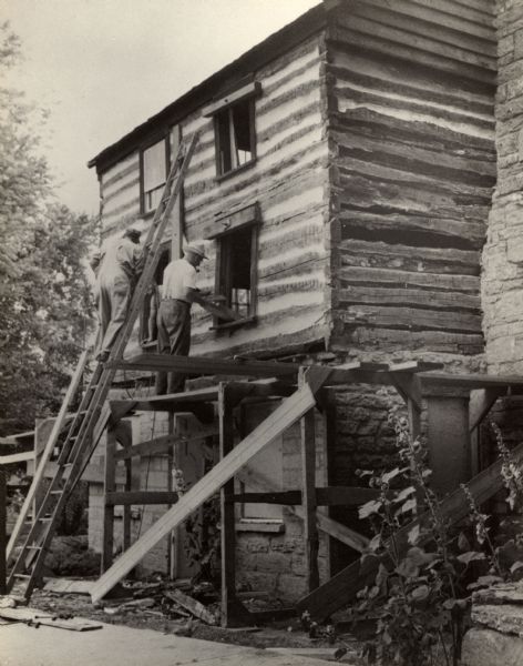 A restored Cornish miner's house, called Polperro, built in the 1840s, on Shake Rag Street undergoing restoration. The house was temporarily covered with siding, but after restoration the siding was removed to reveal the original log construction. The building is currently owned by the Wisconsin Historical Society and is one of several structures that comprise the Pendarvis historic site.