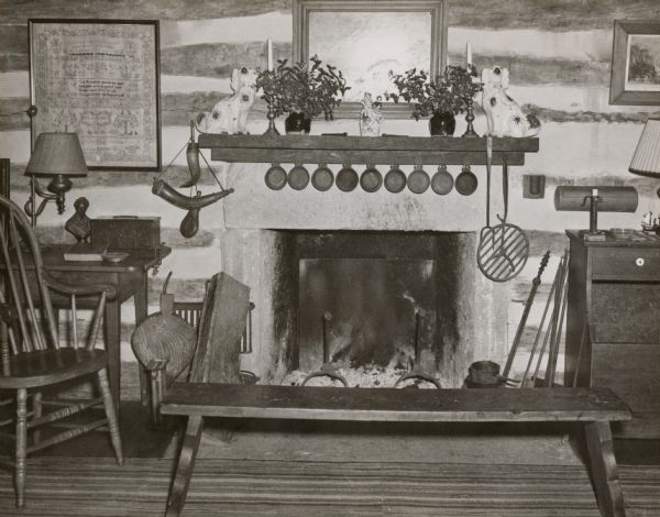 The living room in the restored Cornish miner's house, called Polperro, on Shake Rag Street. The house was temporarily covered with siding, but after restoration the siding was removed to reveal the original log construction. The home is now owned by Robert M. Neal.