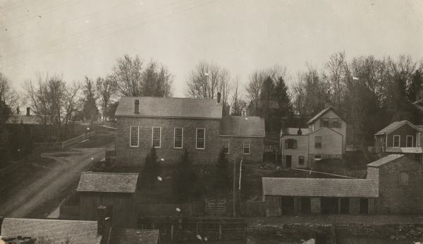 View over rooftops towards the primitive Methodist Church, which is surrounded by homes.