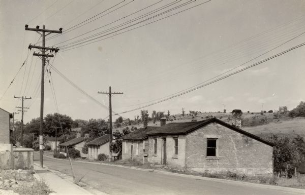 Shake Rag Street, showing Cornish miner's homes. The street was formerly called Hoard Street in honor of R.C. Hoard who was stationed at Fort Defiance during the Black Hawk War (1831-1832).