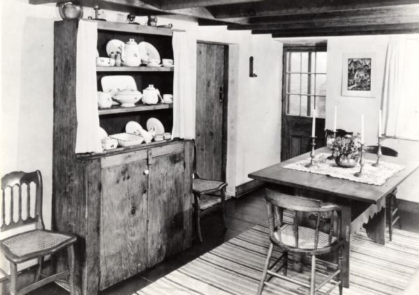 The dining room in the Cornish miner's cottage on Shake Rag Street called Trelawny. The cottage was restored under the ownership of Robert M. Neal and is now used to serve Cornish meals to guests by special reservation.