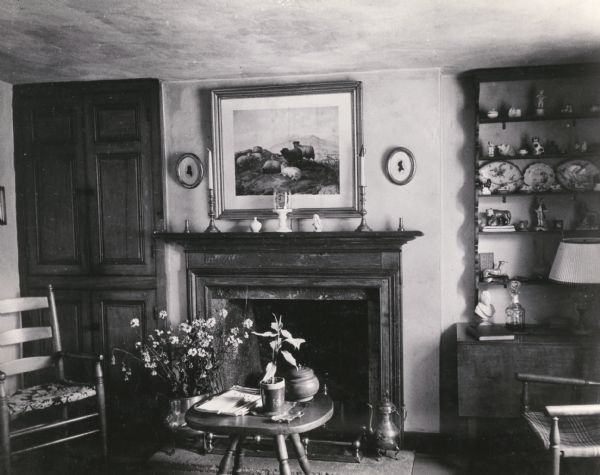 The living room with a fireplace in the Cornish miner's cottage on Shake Rag Street called Trelawny. The cottage was restored under the ownership of Robert M. Neal and is now used to serve Cornish meals to guests by special reservation.