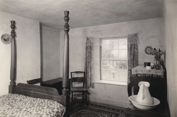 The bedroom in the Cornish miner's cottage on Shake Rag Street called Trelawny. The cottage was restored under the ownership of Robert M. Neal and is now used to serve Cornish meals to guests by special reservation.
