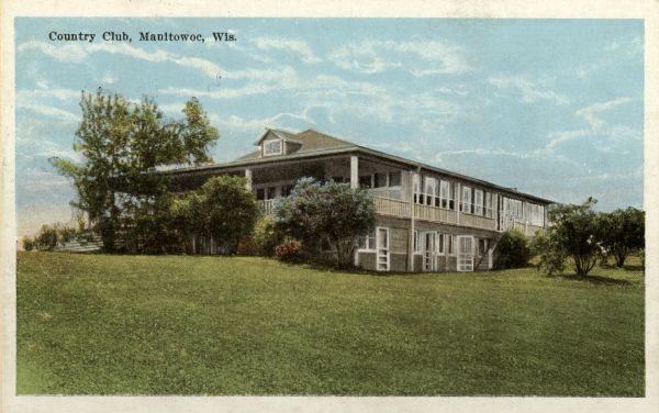 View across lawn toward the club building. Caption reads: "Country Club, Manitowoc, Wis."