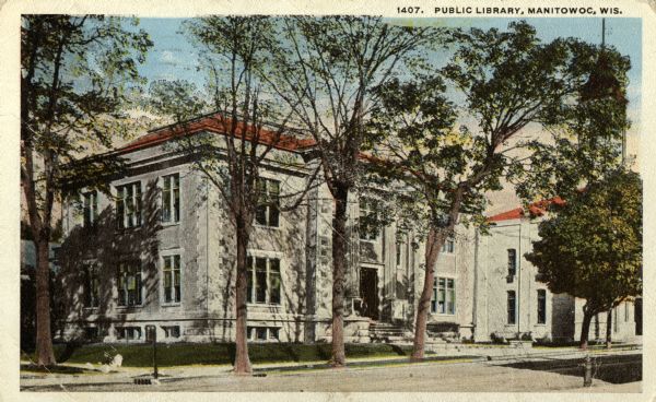 View across street toward the library. Caption reads: "Public Library, Manitowoc, Wis."
