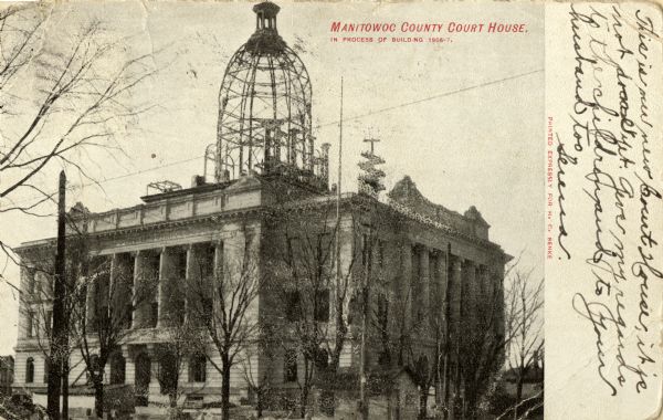 The Manitowoc County Court House. Caption reads: "Manitowoc County Court House. In Process of Building 1906-7."