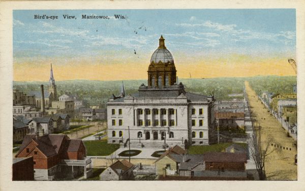 Elevated view of Manitowoc, dominated by the Manitowoc County Court House. Caption reads: "Bird's-eye View, Manitowoc, Wis."