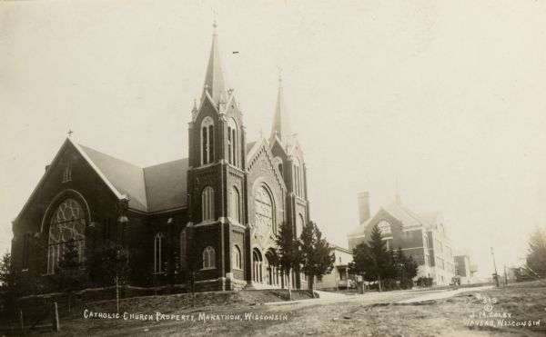 A highly decorative and ornamented Catholic church in Marathon. Caption reads: "Catholic Church Property, Marathon, Wisconsin".