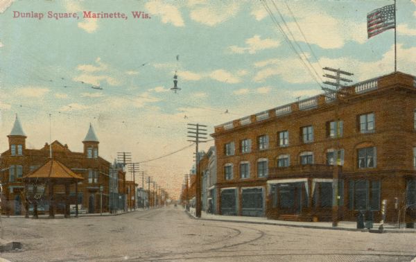 View of the square, with storefronts surrounding it. There is a pavilion on the far side. Caption reads: "Dunlap Square, Marinette, Wis."