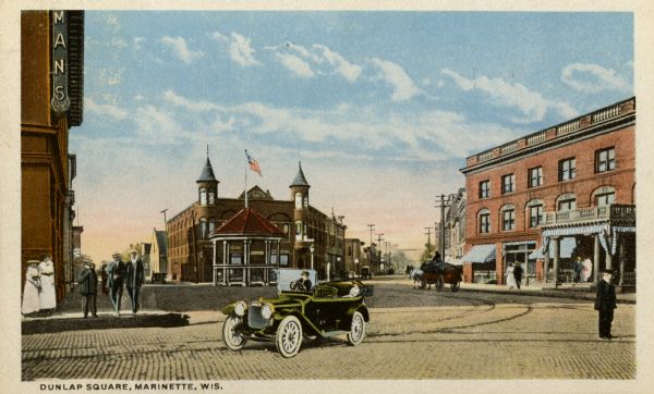 View toward the wide square, with automobiles and horse-drawn vehicles. Pedestrians are on the sidewalks and in the street. Caption reads: "Dunlap Square, Marinette, Wis."