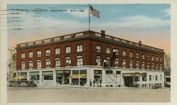 View across intersection toward the hotel. Caption reads: "Hotel Marinette, Marinette, Wis."
