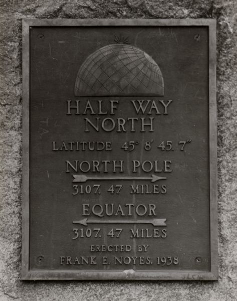 The 45th parallel of north latitude marker, marking halfway between the equator and the north pole. The marker is located on Highway 141, three miles north of Lena.