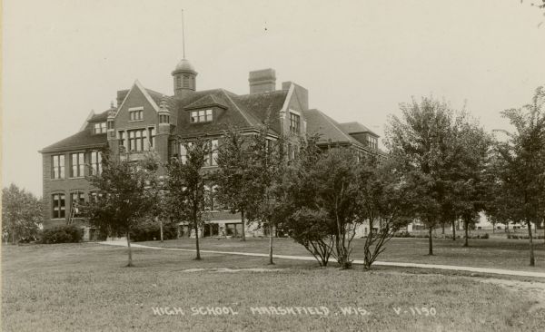 A high school building in Marshfield. Caption reads: "High School Marshfield, Wis."