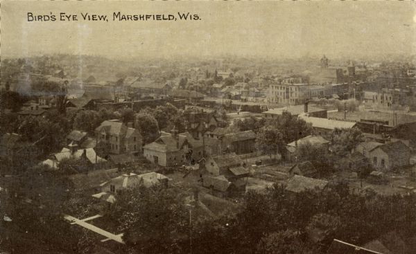 An elevated view of town. Caption reads: "Bird's Eye View, Marshfield, Wis."