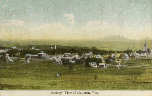 View across fields toward the town. Caption reads: "Birdseye[sic] view of Mauston, Wis."