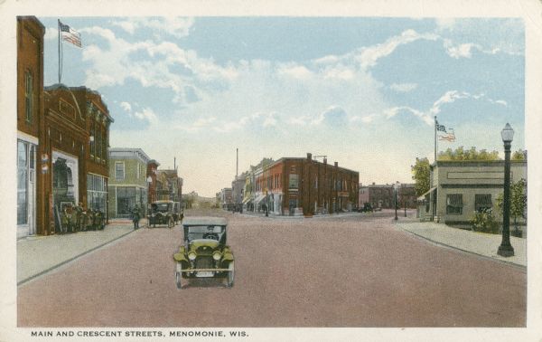View looking toward Main and Crescent Streets. Caption reads: "Main and Crescent Streets, Menomonie, Wis."