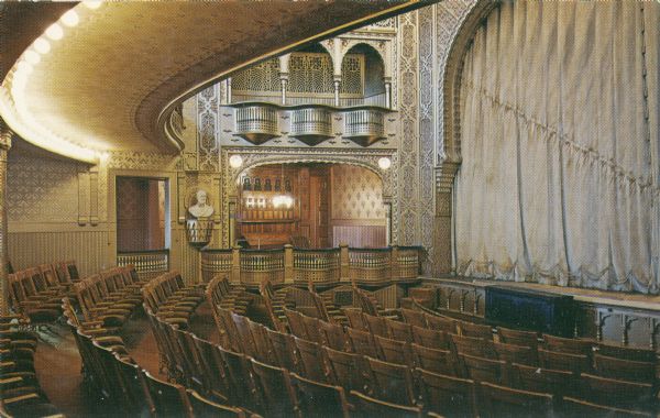 The interior of the Mabel Tainter Memorial Theater, designed by architect Harvey Ellis. The Mabel Tainter Memorial building was a facility erected in 1889-1890 with funds provided by Andrew Tainter, part owner and manager of the Knapp, Stout and Co. Lumber Co. A memorial to Tainter's daughter (who died tragically at age 20), the building was administered by an endowed trust known as the Mabel Tainter Library, Literary and Educational Society. It was also utilized initially for religious services by the local Unitarian Association of which the Tainter family were members.