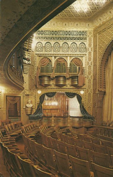 The interior of the Mabel Tainter Memorial Theater. The Mabel Tainter Memorial building was a facility erected in 1889-1890 with funds provided by Andrew Tainter, part owner and manager of the Knapp, Stout and Co. Lumber Co. It was designed by architect Harvey Ellis. A memorial to Tainter's daughter (who died tragically at age 20), the building was administered by an endowed trust known as the Mabel Tainter Library, Literary and Educational Society. It was also utilized initially for religious services by the local Unitarian Association of which the Tainter family were members.