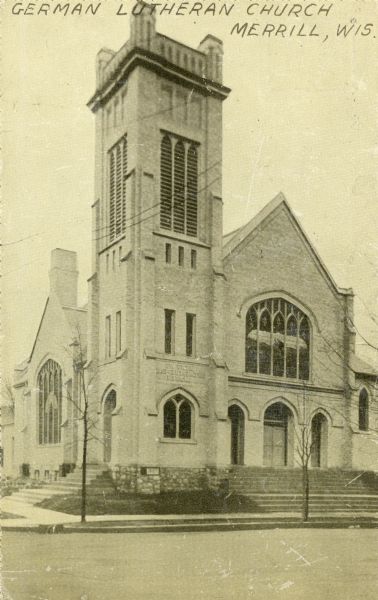 View across street toward the church. Caption reads: "German Lutheran Church, Merrill, Wis."